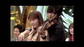 Seohyun being back-hugged by a violinist