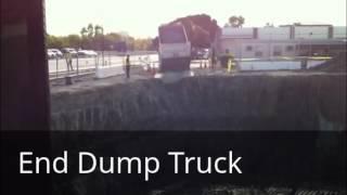 Watch an End Dump Truck dump a load in a Construction Pit!