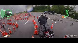 Official timed run Top Cop for Kids Motorcycle Skills Challenge in the rain