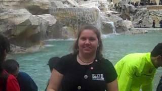 Tossing a coin into the Trevi Fountain!