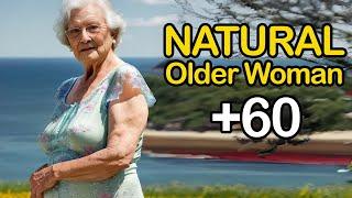 Natural Old Woman Over 60 Flowers and the Ocean Attractive And Classy Dressed