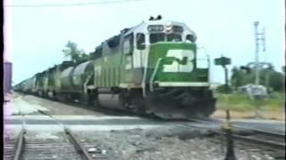 Burlington Northern fuel tender, cabooses and odd paint schemes. 6/11/1991