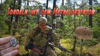 Sondel mit dem Metalldetektor.Fundeskalation im Wald.Lehmi08