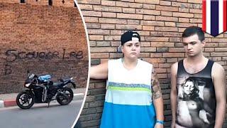 Tourists graffiti old wall in Thailand, face prison time - TomoNews