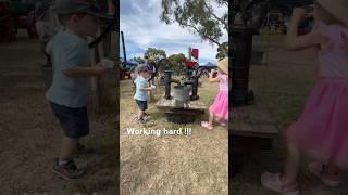 The twins went back in time today, pumping for water #twins #cute #funny #water #sister #dad #pump
