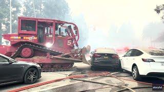 California Fires: Bulldozers move cars during fires