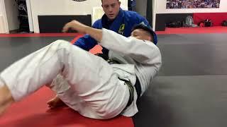 Escaping the omoplata with a front roll