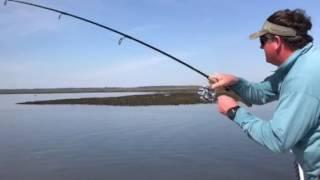 Trey with Capt. Scott catching a big redfish. www.southeasternangling.com