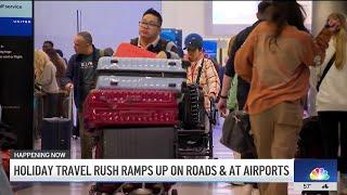 Holiday travel rush ramps up on roads and airports