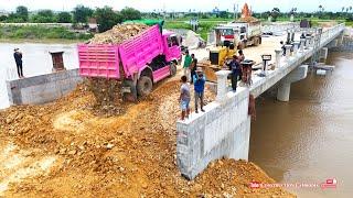 Wonderful Bulldozer pushing soil & dump trucks dumping soil filling Bridge edge connection road