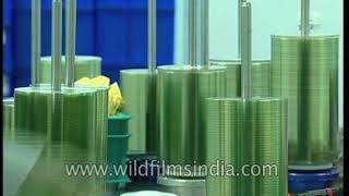 Factory workers inside a CD-ROM production unit in India - archival footage