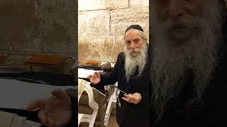 Rav Gutman Locks with R Elchanan Gabay write in S.Torah "MOSHIACH NOW" at t WesternWall in Jerusalem