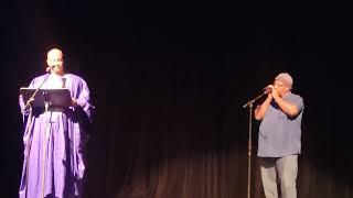 Henry L. Jones Poet Laureate reading poetry accompanied with musician Henry Perry on harmonica