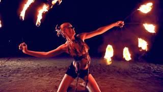 Fire dancing duet. Poi and fire fans