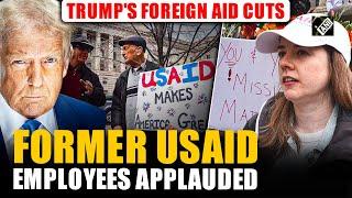 Former USAID employees applauded as they exit offices following Trump's foreign aid cuts