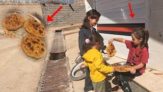 Cooking local bread by the mother and selling bread by the little girl to get money for rent