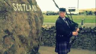 England/Scotland Border complete with Bagpiper!