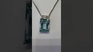 7ct fine blue Aquamarine pendant with a large baguette diamond pendant $7,000.