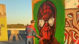 Spiderman draws graffiti