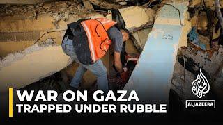 Dozens trapped under rubble after Israeli bombardment in northern Gaza