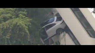 Coral Gables, Fla car hanging from the parking lot