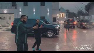 E-money admires his convoy from his house