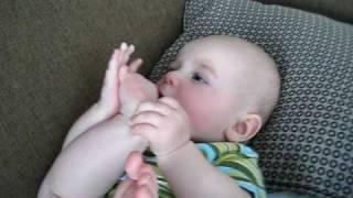 Cute baby eating his toes