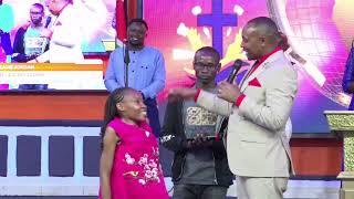 Bishop ben Kiengei heart warming moments with  disabled Girl at Jcm church