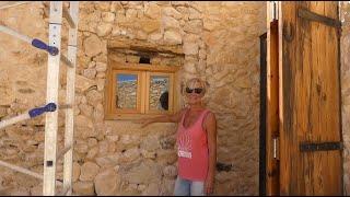 The windows have glass! The stone reveals are done and digging out the problematic roof valley