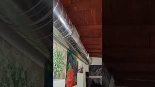 Exposed spiral ductwork inside a small house. 16" internal insulated.