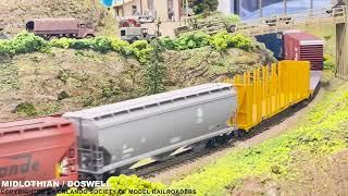 HO Scale BCRAIL Locomotives Pulling a Heavy Freight Train