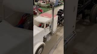 Custom built RC tow truck towing an RC dump truck