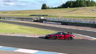 Senna on track and passing a racing Morgan in my 600LT Spider.