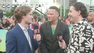 Dawson Mercer and Arthur Kade interview Kane Brown on the black carpet at the 2022 MTV VMAs.