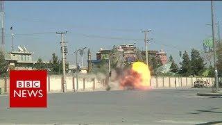 Afghan forces blast TV station wall as they target militants - BBC News