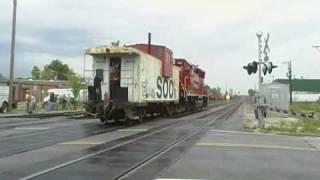 CP gp38-2 pushes a soo line caboose through frabklin park with horn