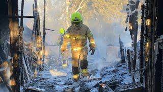 Firefighters at site in Israel's Safed after rockets fired from Lebanon | AFP