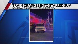 Train crashes into stopped car on railroad crossing