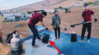 Iran nomadic life: tarring the roof of the house by Hassan and paying wages to the building master