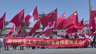 Personas de todos los ámbitos sociales dan la bienvenida al presidente chino Xi Jinping a Perú