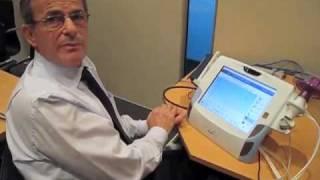 Professor Branko Celler demonstrating the home health monitoring unit (ABC Radio National)