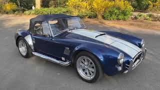 Our AC Cobra with its soft-top roof on.