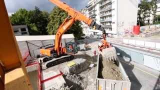 Clamshell telescopic arm on a Hitachi medium excavator (ZX350LC-5) at railway project