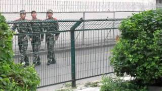 Chinese Guards changing shift outside the American Embassy in Shenyang, China.MOV