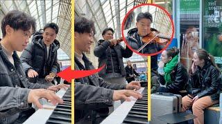 A famous violinist joins me while I am playing in the train station