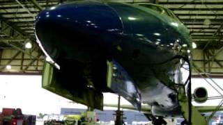 Aircraft gear being raised and lowered in hangar