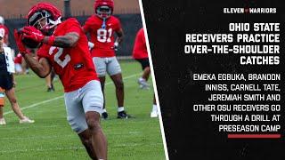 Ohio State receivers practice over-the-shoulder catches during preseason camp drill