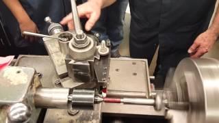 Instructor Kim Munson demonstrates thread cutting on a lathe Part3