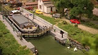 One of the best model railroad layouts with a lock for ships and with a perfect landscape design