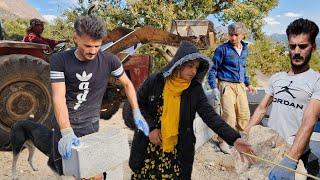 Nomadic life:building a wall for a nomadic house: friends help a nomadic couple for a block of china